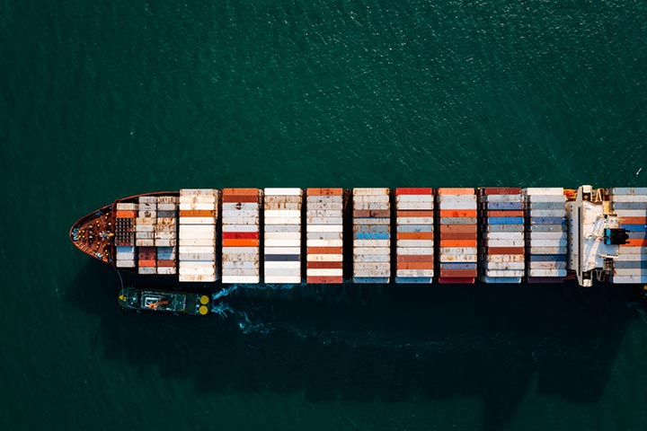 A container ship from above sailing through the sea