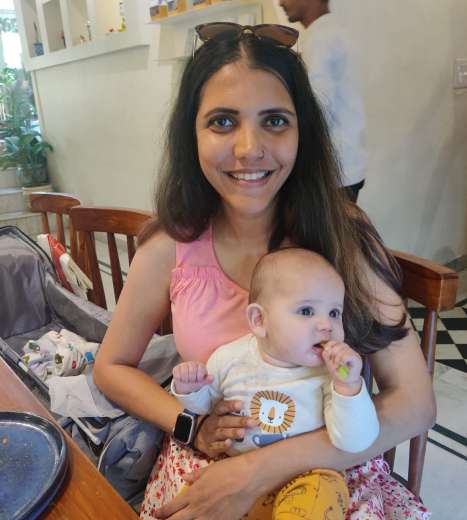 A picture of Malavika with her baby