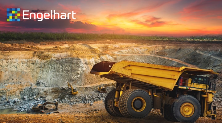 Sunset over a mine with a truck in the foreground