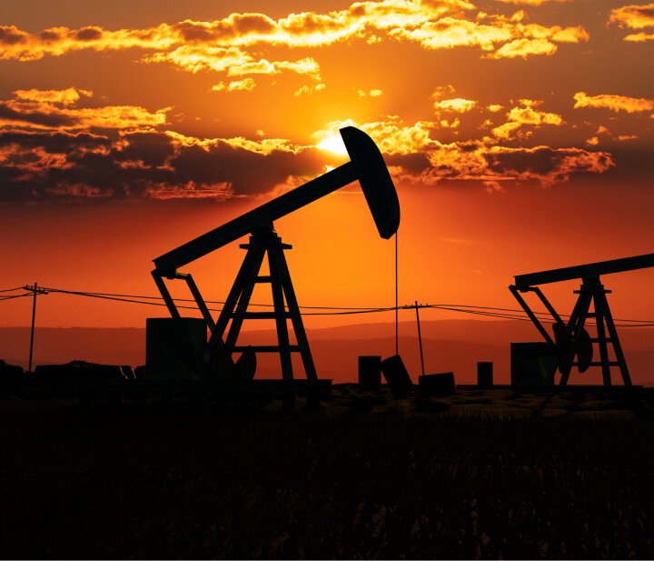 An oil field at sunset