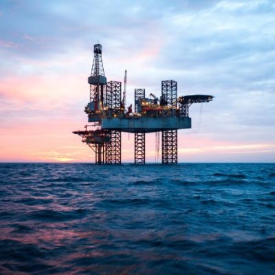 Picture of an oil rig in the sea at dawn