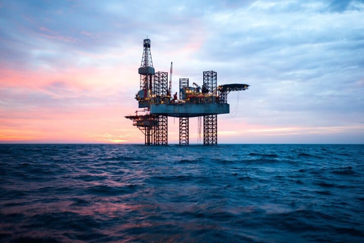 Picture of an oil rig in the sea at dawn