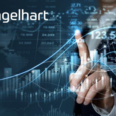 Image of a male finger pointing to financial chart on screen