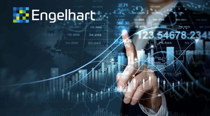 Image of a male finger pointing to financial chart on screen