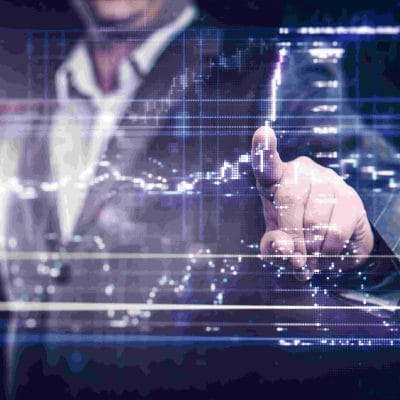 Businessman working with modern computer controlling stock market.