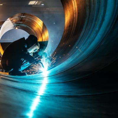 The welder is welding steel plates